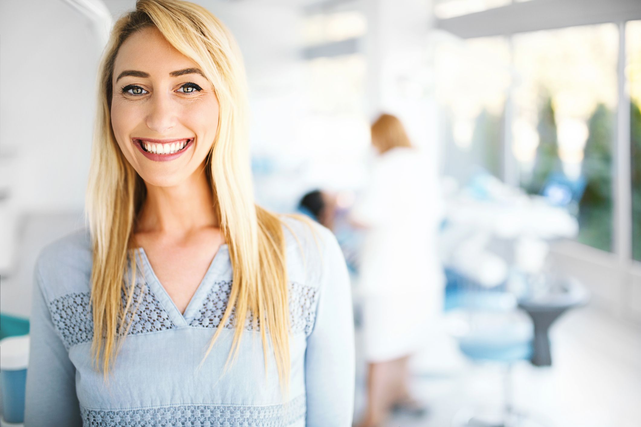 Young female patient smiling and looking at camera in a dental office botox cosmetic dentistry dentist in Strongsville Ohio